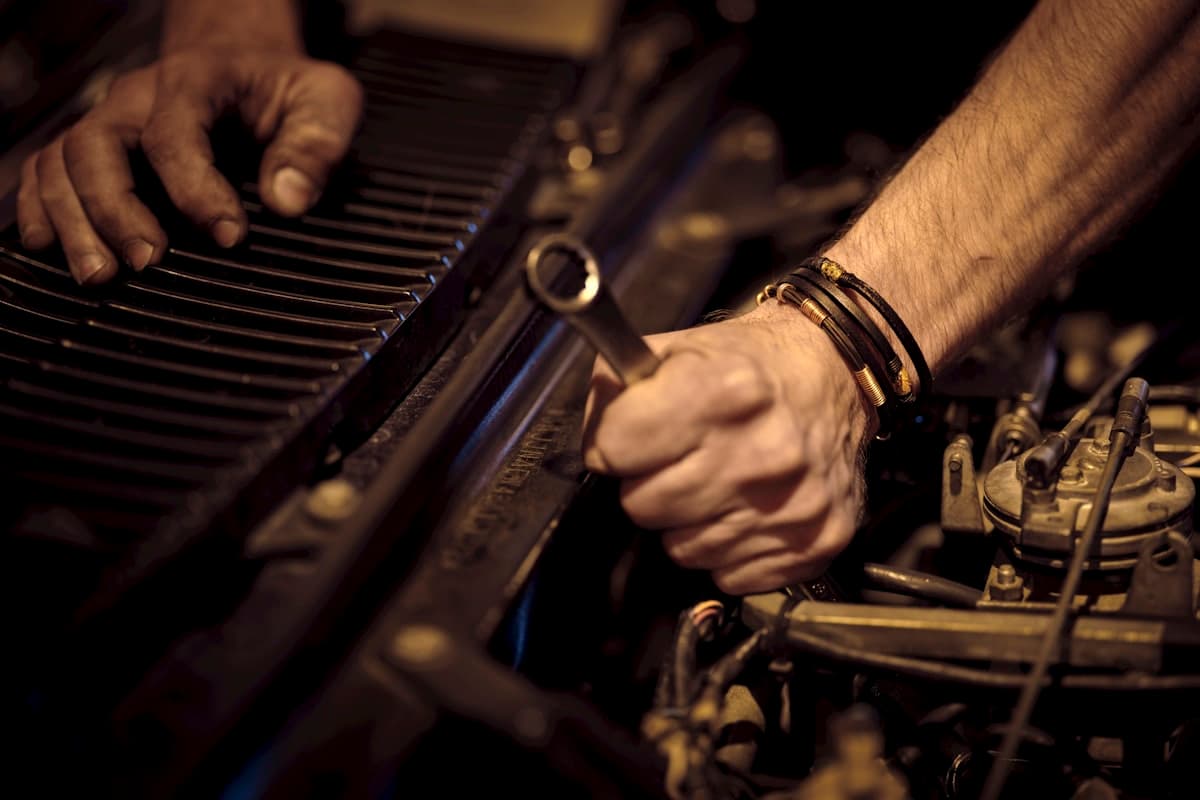 Mechanic working under the hood